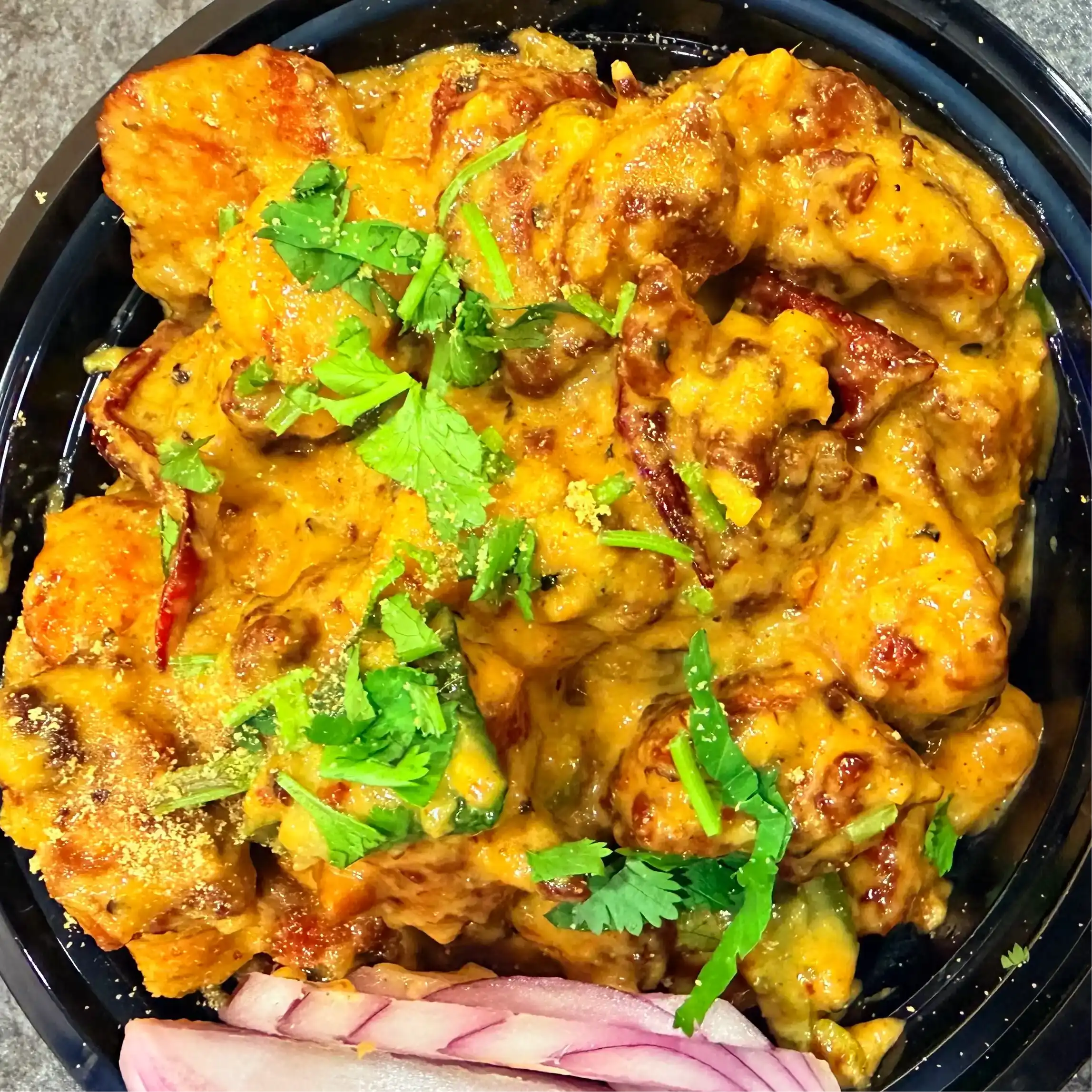 Creamy Garlic Chicken — Succulent chicken pieces are bathed in a luxurious, velvety cream at Hashtag India, Overland Park
